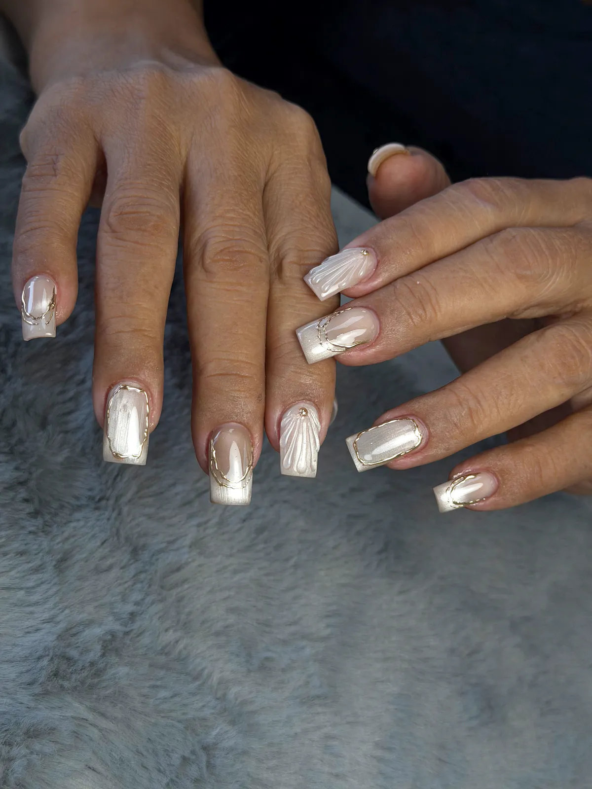 Square pearl-champagne chrome nails with gold frames and shell ridges, by BeautyFusionClau in Sarasota, Florida
