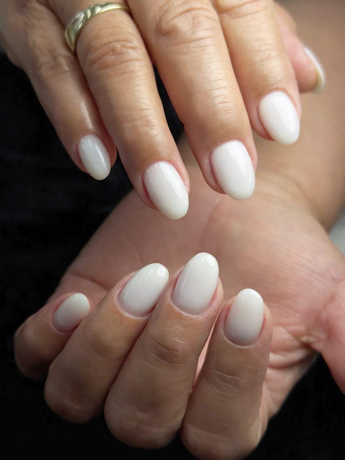 Almond nails in glossy milky white, by BeautyFusionClau in Sarasota, Florida